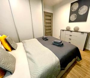 Posteľ alebo postele v izbe v ubytovaní Apartament Rejs