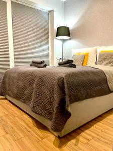 Posteľ alebo postele v izbe v ubytovaní Apartament Rejs