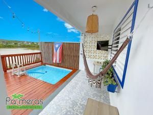 Het zwembad bij of vlak bij Palmeras Beach Apartments - Playa Santa