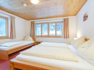 Postel nebo postele na pokoji v ubytování Chalet Peter
