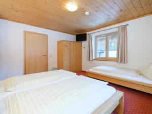 Postel nebo postele na pokoji v ubytování Chalet Peter