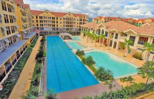 an overhead view of a pool at a resort at 2 Bedroom Condo Unit Cebu Spacious and Convenient in Cebu City