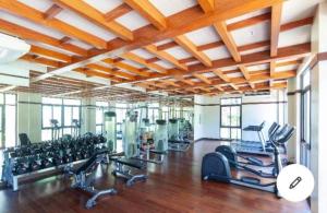 a gym with lots of treadmills and exercise equipment at 2 Bedroom Condo Unit Cebu Spacious and Convenient in Cebu City