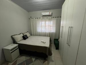 Giường trong phòng chung tại Loft 05 Excelente Localização