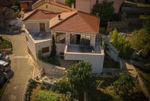 an overhead view of a house with a roof at Holiday house with a parking space Svirce, Hvar - 22571 in Jelsa