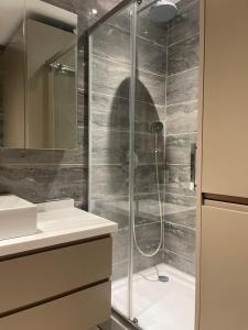 a bathroom with a shower and a sink at Brand & Luxurious Suite near- Mall of Istanbul in Istanbul