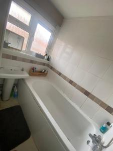 a bathroom with a bath tub and a sink at 9 Russell court, king close in London