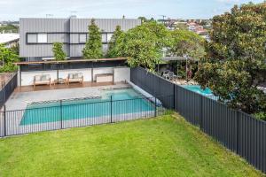 an exterior view of a house with a swimming pool at Beautiful Modern Home in Heart of New Farm in Brisbane