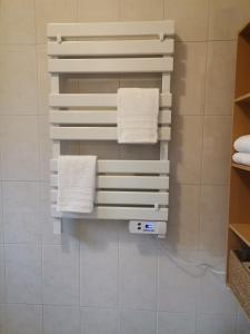 a bathroom with white towels on a wall at Quinta Souto da Ordem - House in Castelo Novo