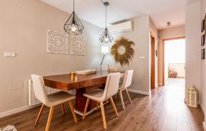 a dining room with a wooden table and chairs at Awesome Apartment In Torre Pacheco With Wifi in Torre-Pacheco