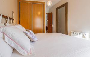 a bedroom with a large white bed with pillows at Awesome Apartment In Torre Pacheco With Wifi in Torre-Pacheco
