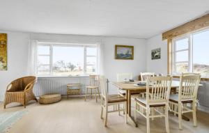 a dining room with a table and chairs at 3 Bedroom Pet Friendly Home In Frøstrup in Frøstrup