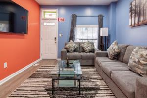 a living room with a couch and a table at Fabian's Place in Baltimore