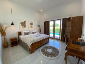 Postel nebo postele na pokoji v ubytování The Jangkar Canggu Guesthouse & Villa
