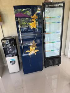 a vending machine with flowers on the side of it at Canggu Nadi 2 Guest House in Canggu