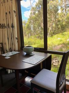 a desk in front of a window with a view at Mountain Tranquility in Mount Tomah