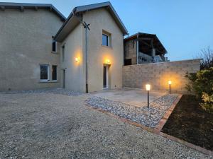 a house with two lights in front of it at Suite Love et Evasion in Saint-André-le-Gaz