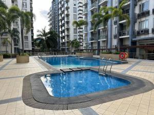 a large swimming pool in the middle of a building at One Palm Tree villas with free parking in Manila