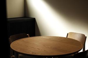 a wooden table and two chairs in a room at SOUQ Renovated Townhouse in Himeji Quiet Market District in Himeji