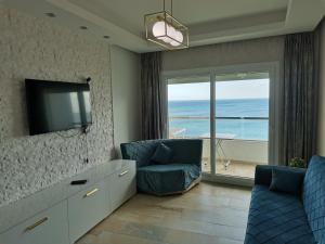 AppartF3 vue panoramique sur mer Residence Vista Del Mar TV 또는 엔터테인먼트 센터