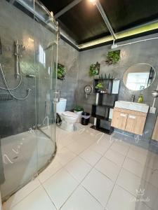 a bathroom with a shower and a toilet and a sink at Apple house cafe in Ban Rong Fong