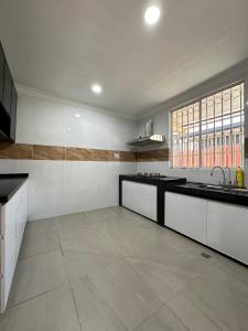 Köök või kööginurk majutusasutuses Penampang Delima House