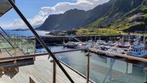 a view of a marina with boats in the water at Lofoten Seaside in Ballstad