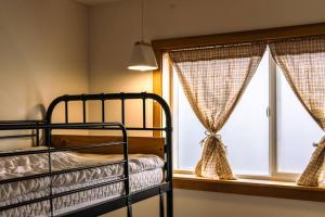 Postel nebo postele na pokoji v ubytování Peanut House