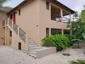 a house with stairs in front of it at Kato William in Nialon