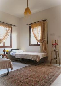 a bedroom with a bed and a window at Sea-Blended Nature House in Ayia Trias