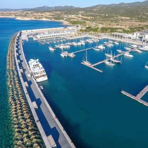 an aerial view of a harbor with boats in the water at Sea-Blended Nature House in Ayia Trias