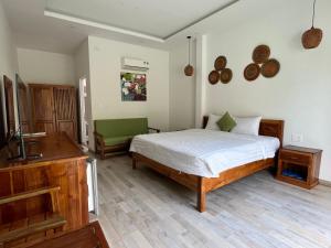 a bedroom with a bed and a sink at Ninila Villa Phu Quoc in Phu Quoc +15 photos