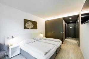 Postel nebo postele na pokoji v ubytování Hotel SKI