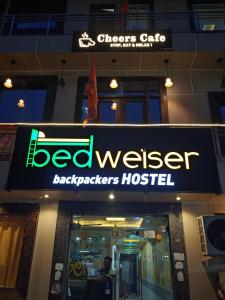 a store sign for a bedbringer backpacks hospital at Bedweiser Backpackers Hostel in Agra