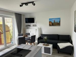 TV a/nebo společenská místnost v ubytování Küstenbude Ankerplatz