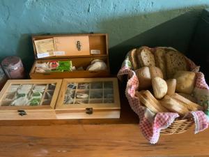 a basket of bread sitting on top of a table at Can Canaleta Hotel Rural in Santa Coloma de Farners