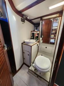 a small bathroom with a toilet and a sink at The Sailboat Home BCN in Barcelona