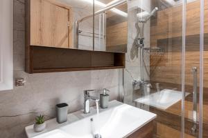 a bathroom with a sink and a shower at The Cactus Project in Loutraki