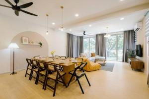a living room with a table and a couch at 3StoreyFamilyFriendly LakeVilla@Putrajaya@BathTub in Putrajaya
