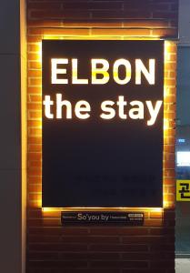 a sign that says elon the stay on a brick wall at ElbonThe Beach Haeundae in Busan