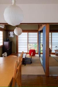 a dining room with a long table and chairs at Tokushima - house / Vacation STAY 573 in Tokushima