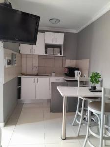 A kitchen or kitchenette at Kangumine Self Catering Units