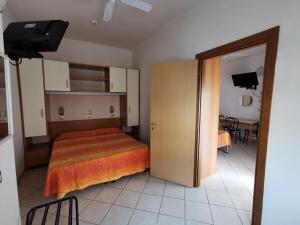 Postel nebo postele na pokoji v ubytování B&B Residence Sorriso