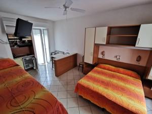 Kuchyň nebo kuchyňský kout v ubytování B&B Residence Sorriso