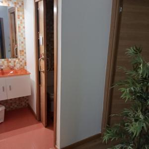 a bathroom with a toilet and a sink and a mirror at Alfonso XII in Redondela +42 photos