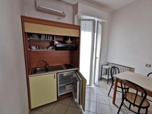 Kuchyň nebo kuchyňský kout v ubytování B&B Residence Sorriso