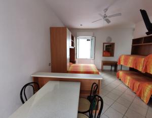 Postel nebo postele na pokoji v ubytování B&B Residence Sorriso