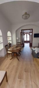 a dining room with a table and chairs in a room at Hiker's TownHouse in Sóller