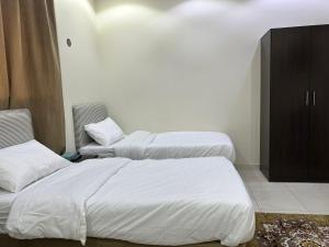Postelja oz. postelje v sobi nastanitve فندق جواهر الهدى