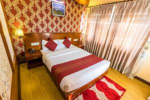 Cama o camas de una habitación en Hotel Pokhara Goodwill